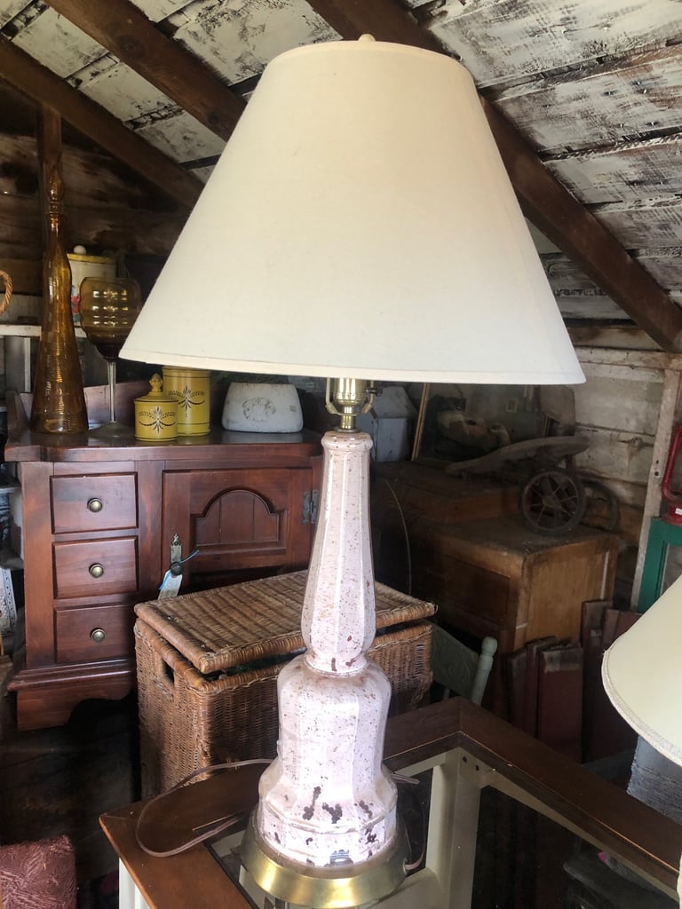 Pink ceramic table lamp with cream linen shade and brass accents
