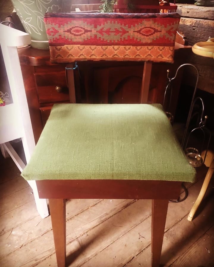 Mid-century wooden bench with green upholstered seat