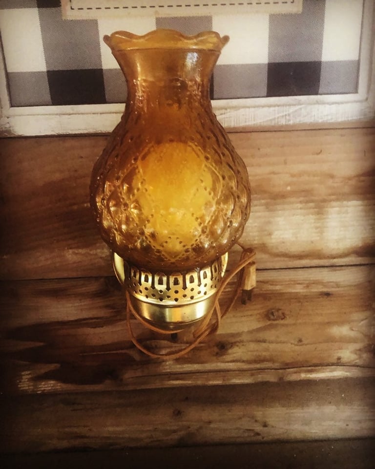 Amber glass hurricane lamp with brass base
