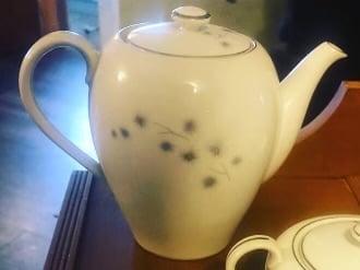 White ceramic teapot with blue pattern